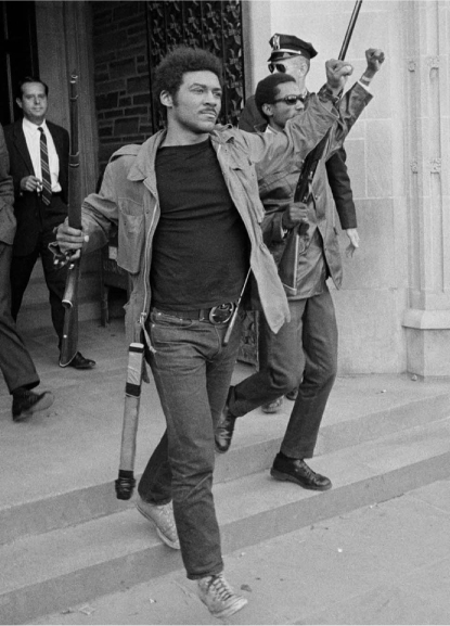 Figure 3 / Tom exiting Willard Straight Hall at Cornell University, April 1969 (By permission of Steve Starr, photographer, AP).
