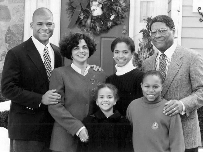 Figure 18 / Nigel, Addie, Vicky, Evonne, Michael, and Tom (left to right) at home in New Canaan, December 1993
