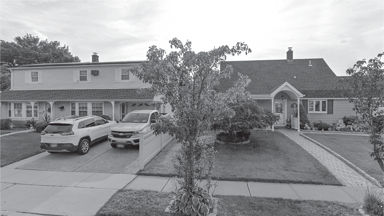 Figure 13.3: A photograph showing houses in Levittown, New York, that have been extensively altered since first built.