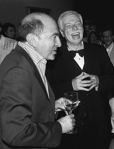 Berezovsky standing with Badri Patarkatsishvili at a gathering. Both are holding glasses and Patarkatsishvili is laughing.
