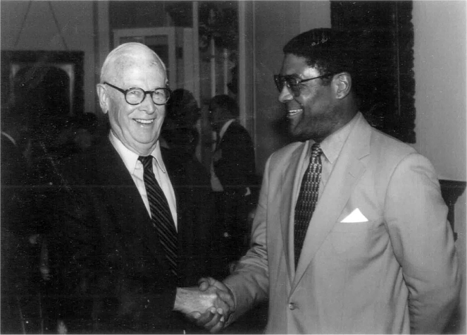 Figure 20 / Tom and former Cornell president James Perkins at the inaugural Perkins Prize award ceremony, May 1995 (Cornell Daily Sun photograph by Aurianne Nappi, Class of 1996).