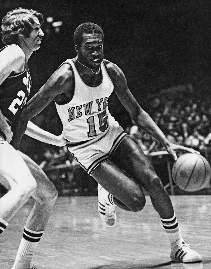 Holding microphones, Almighty Kay Gee and JDL perform for a roped-off crowd on a gymnasium floor.