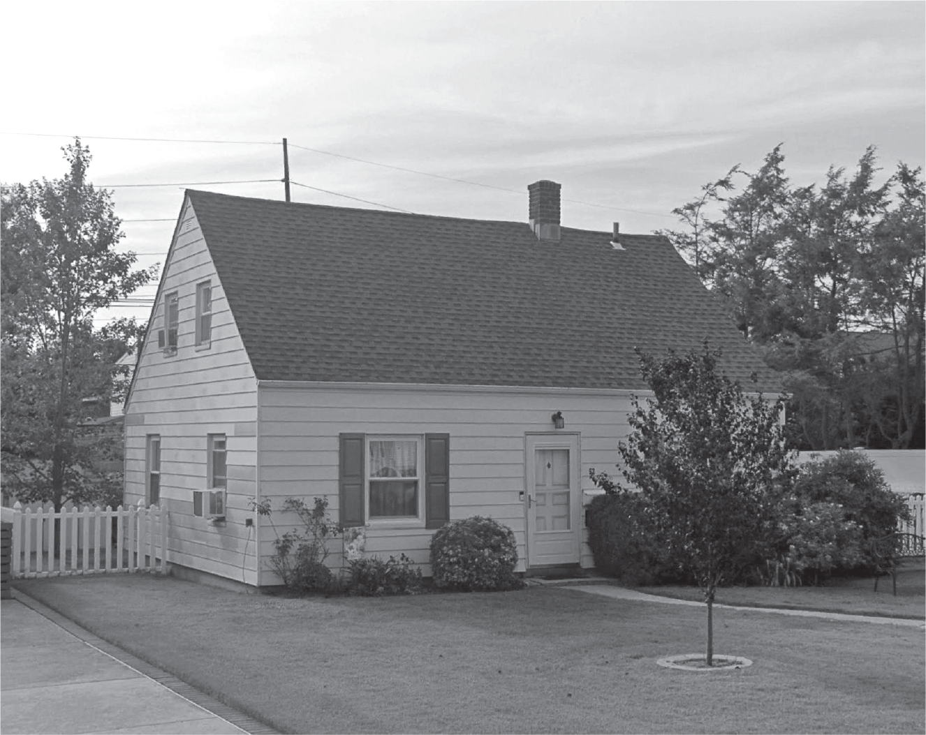 Figure 13.1: A photograph of a house in Levittown, New York, that has remained unchanged since it was built in the 1950s.