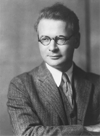 Figure 8.2. Horace Kallen, photographed here as a young man, wearing a three-piece suit and wire-rimmed glasses, smiles warmly.