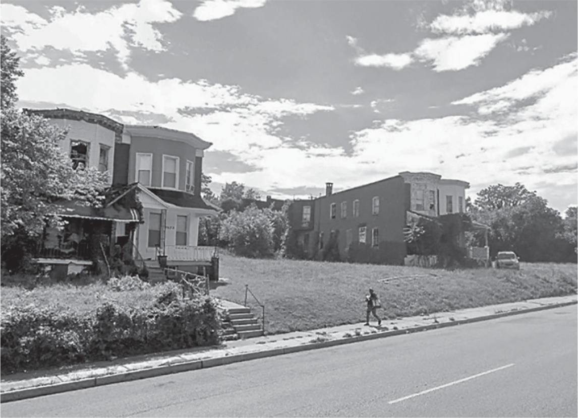 Figure 10.2: A photograph of a street scene in Park Circle showing vacant lots between the houses.
