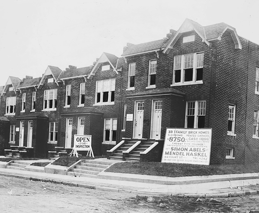 Figure 6.4. Newly built duplex townhouses behind a For Sale sign from the firm of Simon Abels and Mendel Haskel.