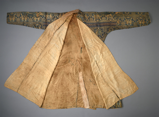 Figure 19.2. A long sleeved, high collared, three-quarter length robe opened to reveal the interior beige silk lining.