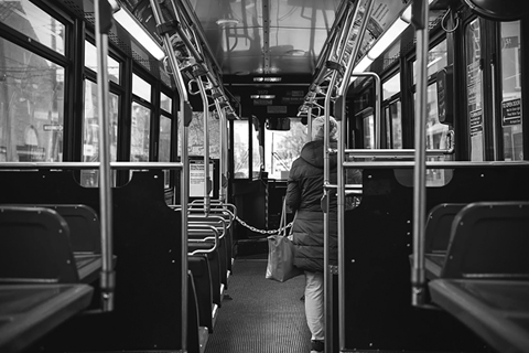 Figure 10. A chain separates a bus driver’s seat from a passenger standing in the aisle of the bus.