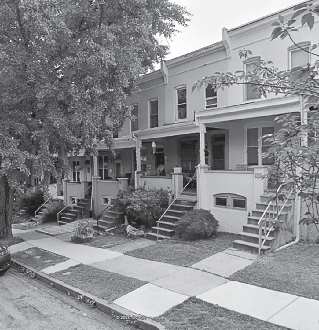 Figure 10.1: A photograph of a street scene in the Hampden neighborhood, showing the intact texture of houses along the street.