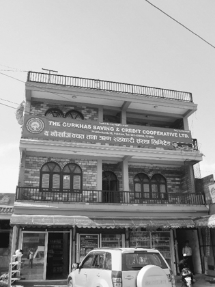 Figure 3.4. A three-story building in Pokhara with signage on the second floor that says The Gurkhas Saving & Credit Cooperative LTD.