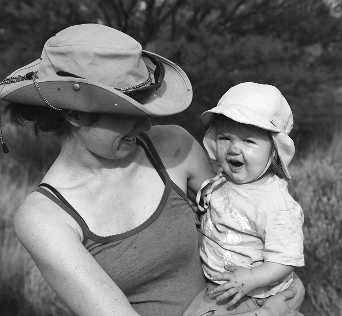 Alison Davis Rabosky holds her daughter Maya. They are both smiling.