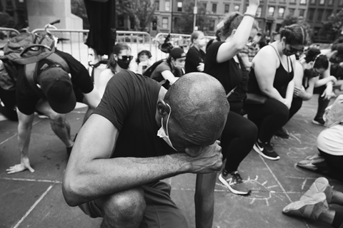 Figure 15. Protestors drop to one knee at a Black Lives Matter demonstration.