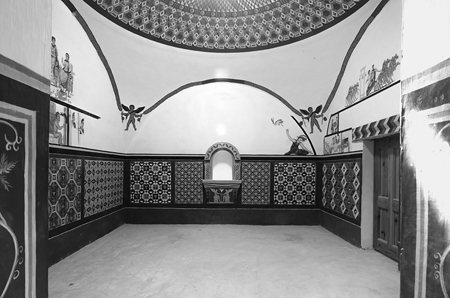 Figure 1.10. Interior view of Serenos’s house Room 1 replica, with a large domed ceiling, centered fountain in the back, and mosaic-decorated walls.