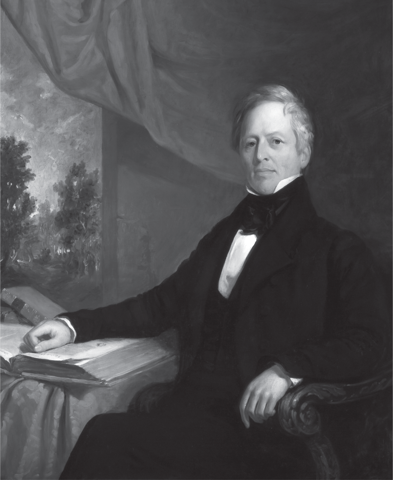 A man with graying hair but looking hale sits upright in formal black and white attire. His right arm lies on top of a large open book resting on a table. Behind the table, a curtain is swept up to reveal trees through the window.