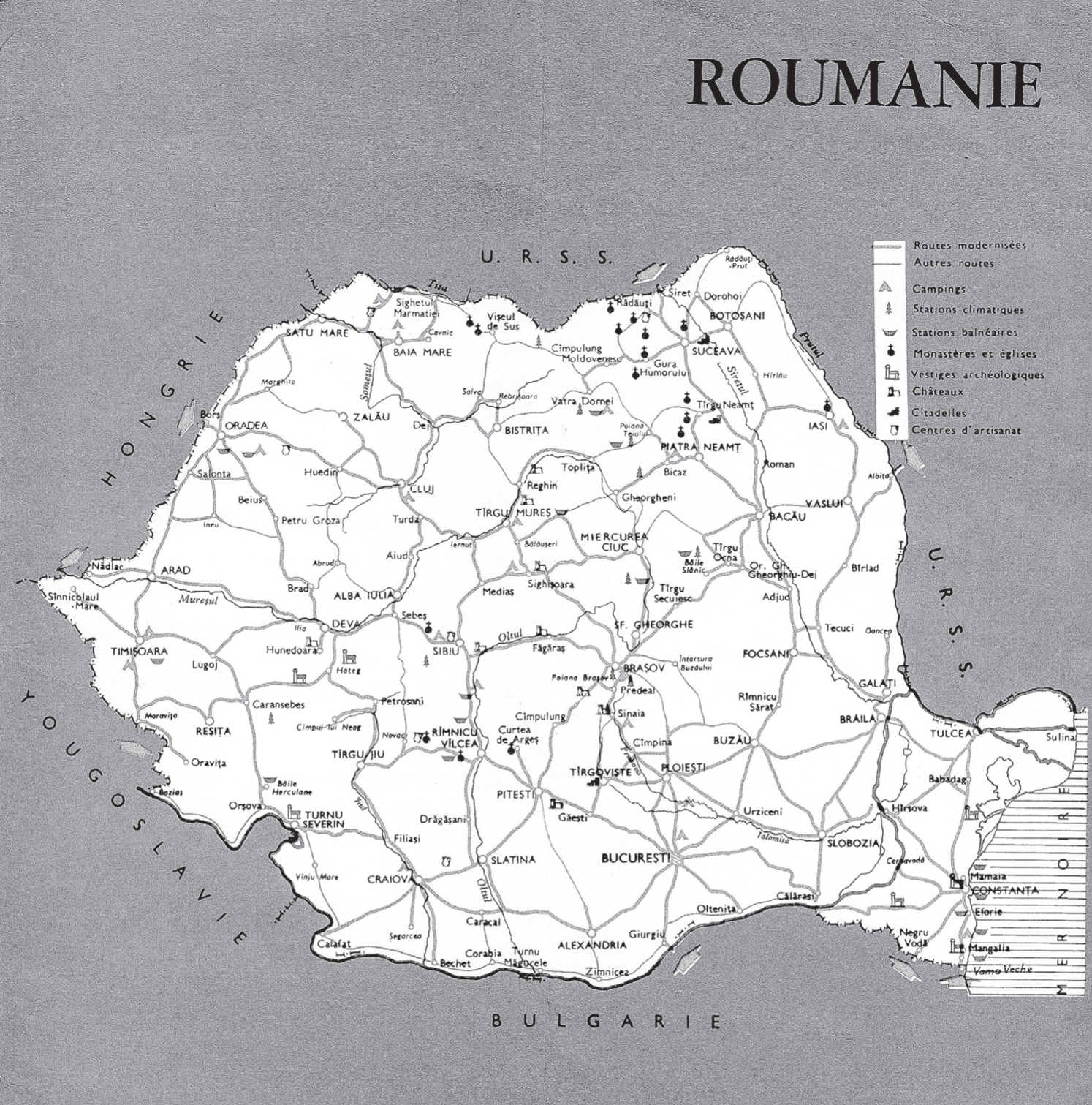 A historical map of Romania from 1966. The title “Roumanie” appears at the top right of the map. The country is in white with grey and black landmarks and is filled in with the road network between cities and the location of rivers. The country is surrounded by solid grey that includes the names of bordering countries. Clockwise, the surrounding areas are the USSR, the Black Sea, Bulgaria, Yugoslavia, and Hungary. The title “Roumanie” appears at the top right of the map.
