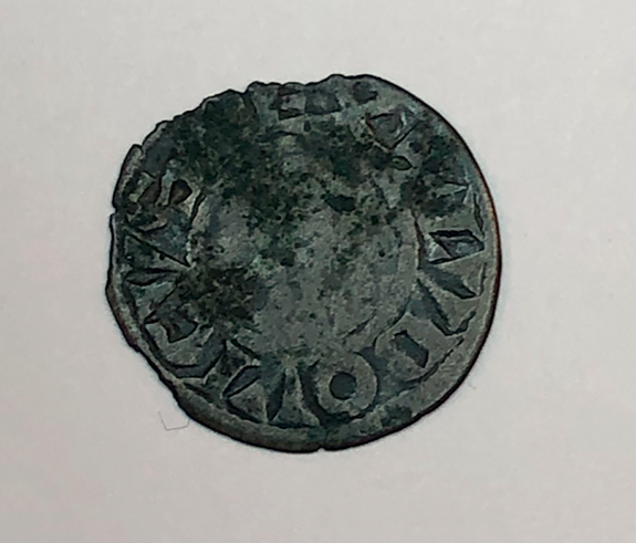 Figure 9.1. The obverse of a silver coin with letters inscribed around the edge.