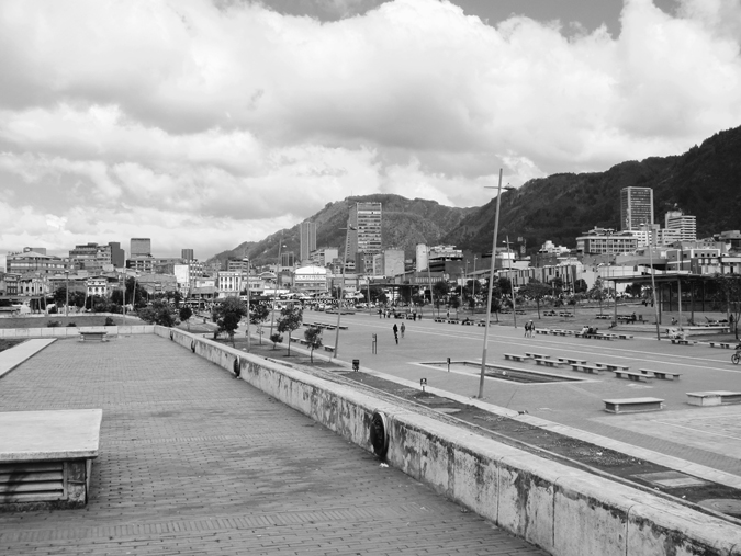 Figure 2.1. A paved city parkway with benches. In the background are buildings in downtown Bogotá and, behind those, the Cerros Orientales (Eastern Hills).