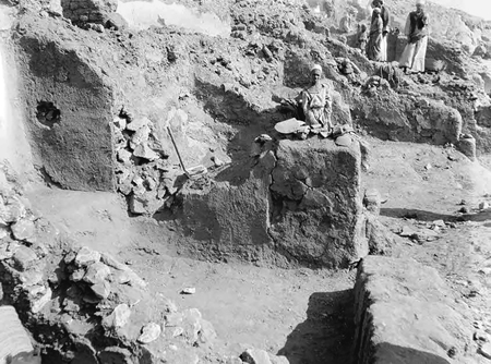 Figure 11.2. A photograph of the exterior excavation and clearing of the North Houses of the Monastery of Apa Thomas at Wadi Sarga. At the top right are three men; center and bottom left illustrates the use of plaster, mortar, thin limestone chips, and mud brick in the design of the various rooms.