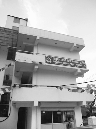 Figure 3.3. A three-story building in Kathmandu with signage on the second floor that says Singapore Gurkha Polyclinic Pvt. Ltd.