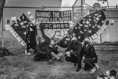 Figure 9. A memorial erected by Naming the Lost Memorials displays the names of the pandemic’s dead on face masks attached to a fence.