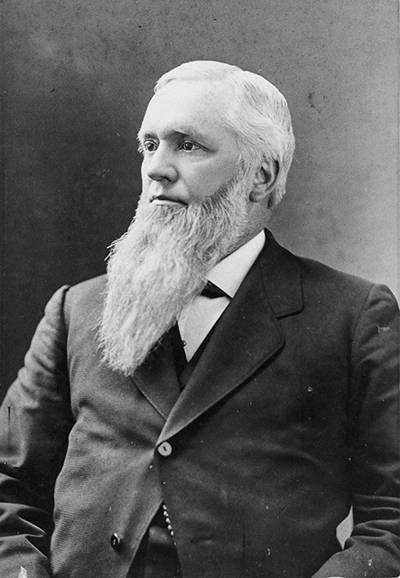 Frontispiece. A man with a long white beard sitting for a formal portrait.