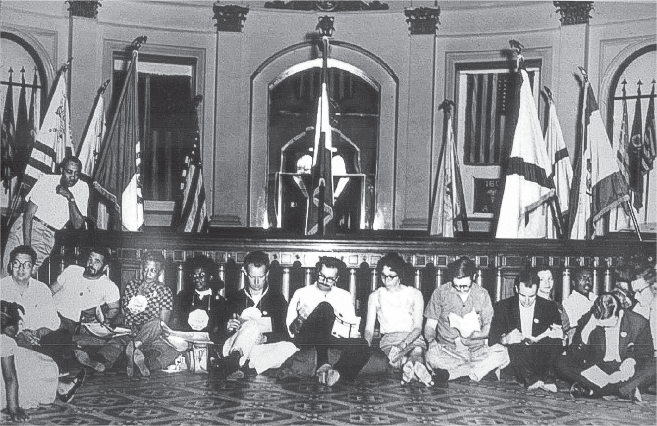 Figure 3.3. CORE members sitting on the ground in the rotunda of the California State Capitol in Sacramento on May 28, 1963.