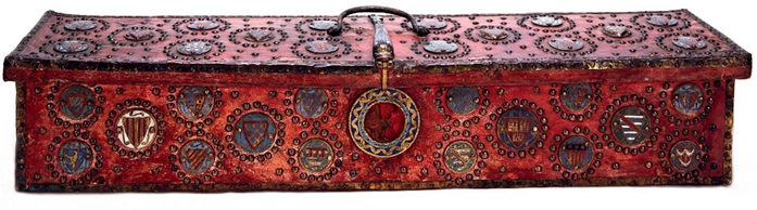 Figure 25. A red rectangular strongbox mounted with jewels and enamel heraldic emblems.