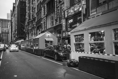 Figure 18. Wooden dining sheds with glass windows line West 32nd Street in the Koreatown section of Manhattan.