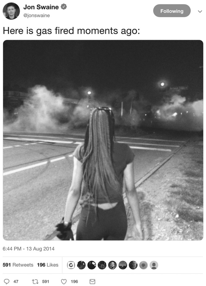 FIGURE 6.5 Woman watching tear gas. Posted on Twitter by Jon Swaine, August 13, 2014. Reproduced by permission from Jon Swaine.