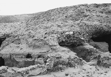 Figure 11.6. An exterior photograph of a monastic dwelling of mud bricks, shale caves, and plaster in the desert.