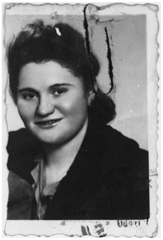 Figure 30. Portrait of a young woman with dark hair and a dark dress.