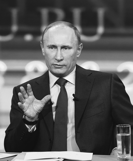Vladimir Putin speaking and making a point with his hand thrust out at a Kremlin event called Direct Line, April 25, 2013.