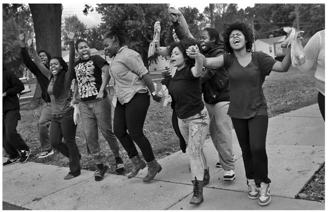 FIGURE 6.2 “Ferguson protesters leave arm-in-arm from the St. Ann Police Department after being released from jail on Friday, Oct. 3, 2014. Protesters have been a constant presence in the St. Louis suburb in the nearly two months since Michael Brown was shot and killed by police officer Darren Wilson.” Associated Press/St. Louis Post-Dispatch. Photo by Robert Cohen.
