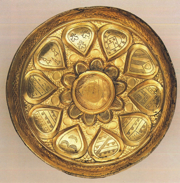 Figure 27.2. A top-down view of a wide circular gilt cup, with ten decorated shields arranged in a circle around a flower-shaped center shield.