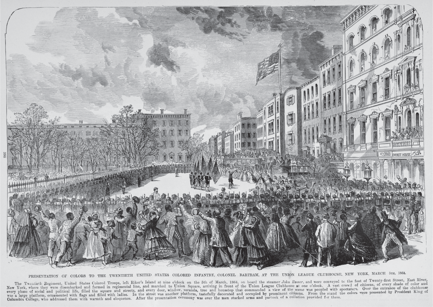African Americans look on approvingly as soldiers at attention ring three sides of an open space in a city square. In the middle, four soldiers present the colors to a reviewing stand and a large group of women.