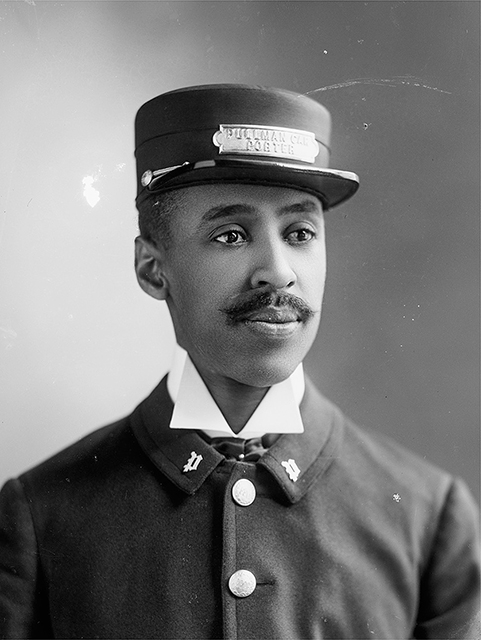 A man in a uniform wearing a cap with the words “Pullman Porter” on it.