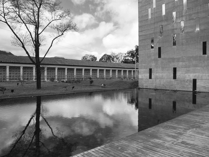 Figure 1.1. A reflecting pool with a long building behind it to the left and a large wall and walkway at the right.